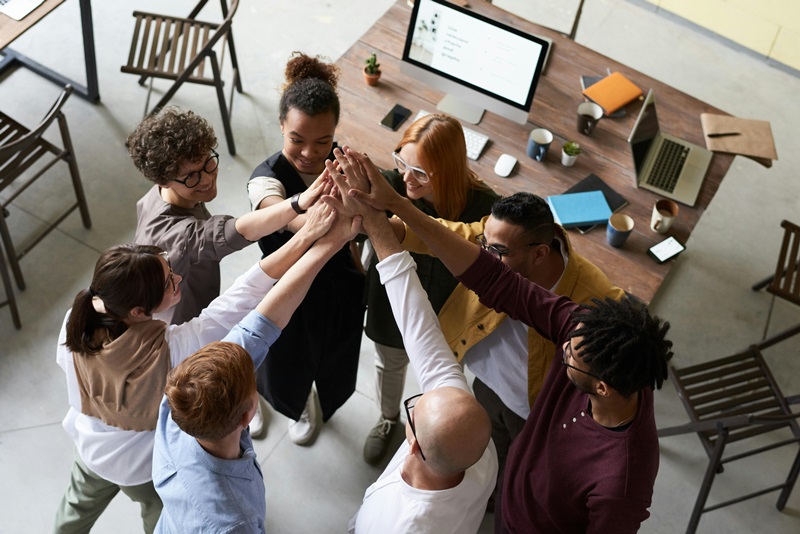 multiple people holding hands